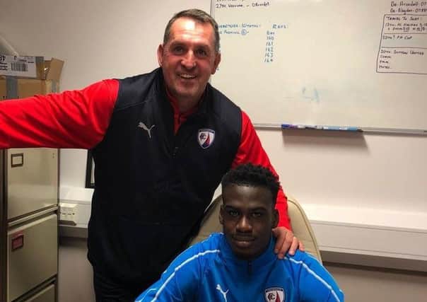 Levi Amantchi signs his first pro deal, with Martin Allen alongside him