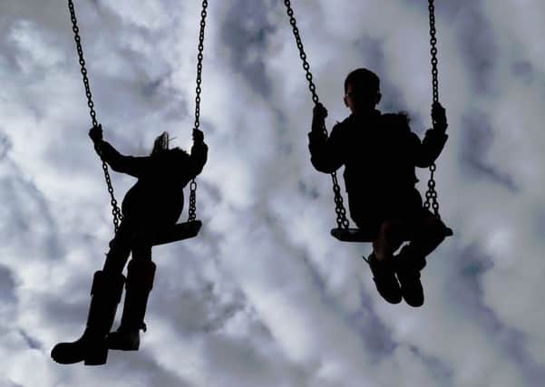File photo dated 4/3/2017 of Children playing on swings. Children are most exposed to dangerous air pollution on the school run and while they are out in the playground, experts have warned.