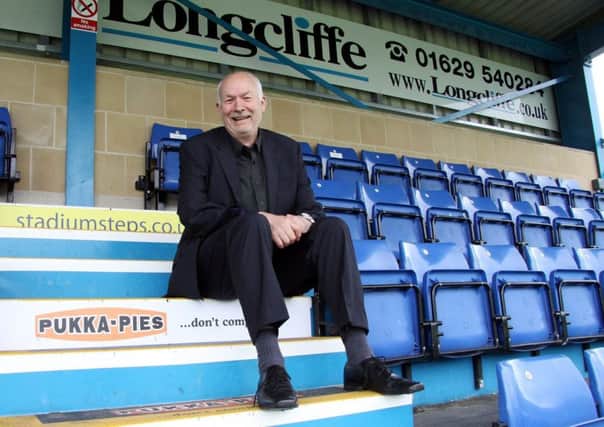 Stepping Forward: Matlock Town chairman Tom Wright pictured on the new advertising steps in The Twigg Stand at the Reynolds Stadium.