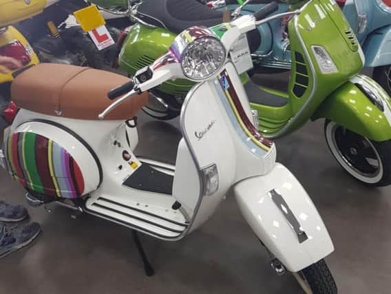 The Vespa scooter.