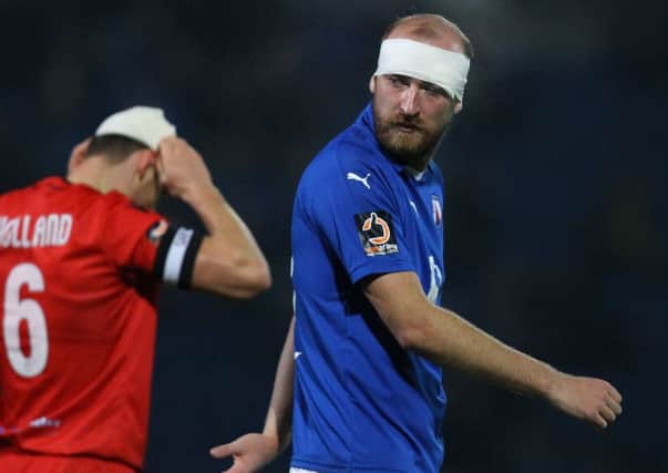 Bandages were the choice of headwear for Chesterfield's Tom Denton and Bromley's Jack Holland after a bruising first half.