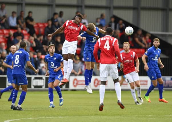 Salford's Devante Rodney heads clear from a corner: Picture by Steve Flynn/AHPIX.com, Football: Vanarama National League match Salford City -V- Chesterfield at Peninsula Stadium, Salford, Greater Manchester, England copyright picture Howard Roe 07973 739229