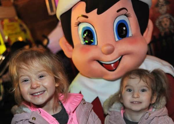 Heanor Christmas lights.
Sienna-Mai, 3 and her 2 year old sister Phoebie-Grace Leigh-Meakin are all smiles at Heanor Market Place on Monday night.