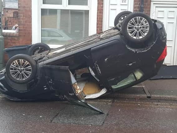 The car on its roof in Brimington. Photo - Ian Andrews.
