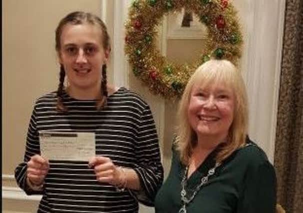 Sophie Widdowson receives a cheque for Â£250 from Wendy Dale, president of Chesterfield Soroptimists.
