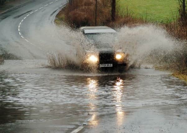 Flooded roads in Derbyshire. Road between Oakerthorpe