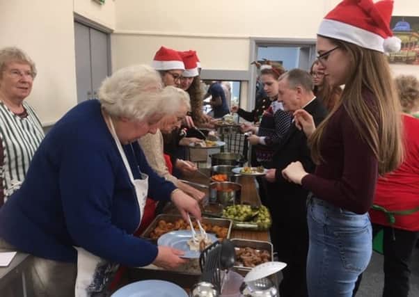 Highfields School sixth formers help out at Matlock's Imperial Lunch Club.