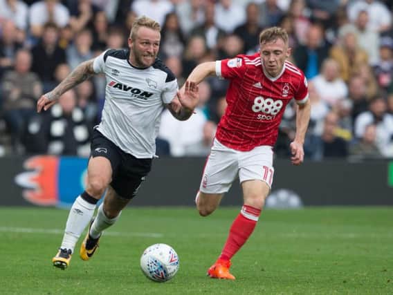 Derby's Johnny Russell and Forest's Ben Osborn battle it out in 2017.