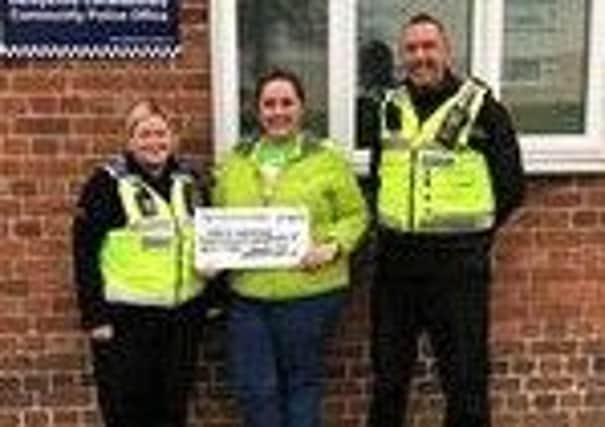 Pictured are PCSOs Adele Chapman-Jones and Karl Marsh presenting a cheque to Ashgate Hospicecare after they organised a fundraising raffle and tombola during a street-meet event in Chesterfield.