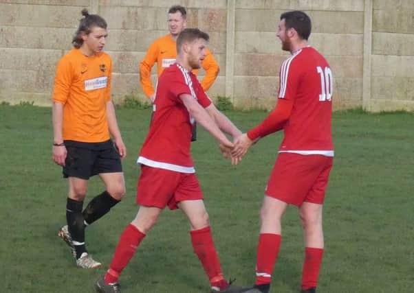 Jordan Hendley  [left] celebrates his second of his hat-trick. Picture by Martin Roberts.