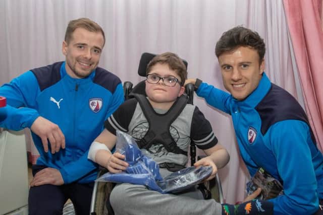 Chesterfield players make this youngster's Christmas. (PHOTO BY: Tina Jenner)