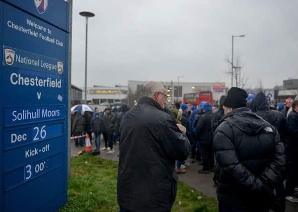 Chesterfield FC fans demonstrate outside the ground before the match