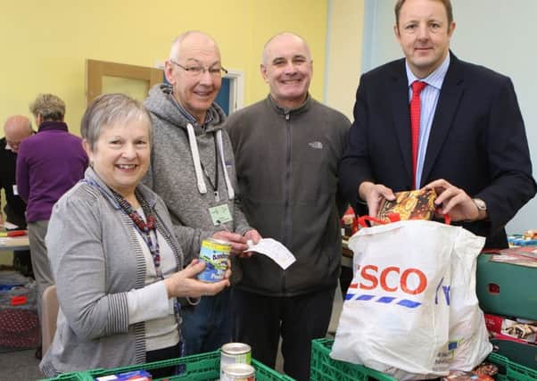 Toby Perkins MP with foodbank volunteers Yvonne Birchmore, Steven Atkins and Jim Hopkins.
