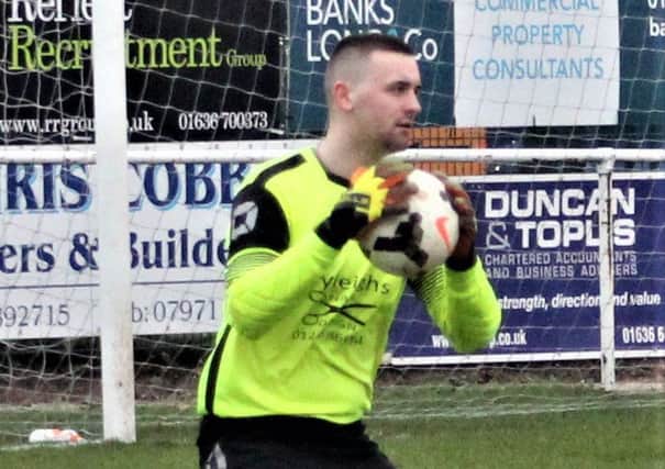 Goalkeeper Ryan Hopkins, who kept Clay Cross Town in the game at snowy Staveley Miners Welfare.