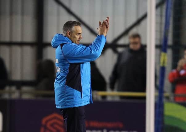 Chesterfield boss John Pemberton applauds the travelling Spireites after a hard-fought draw at Solihull
