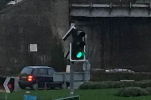 A close-up of the damaged traffic signal at Chesterfield's Horns Bridge roundabout.