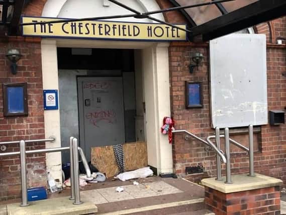 The scene in the doorway to the Chesterfield Hotel building.