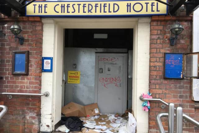 The scene in the doorway to the Chesterfield Hotel building.