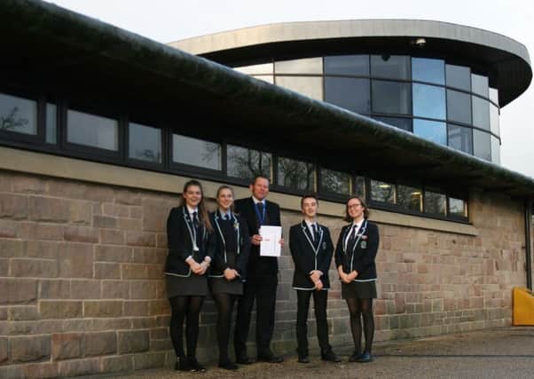 Lady Manners School Sixth Form has received an award from the for the consistently strong progress made by its A-level students over the past three years. Pictured are Sixth Form head Mark Evans and student officers.