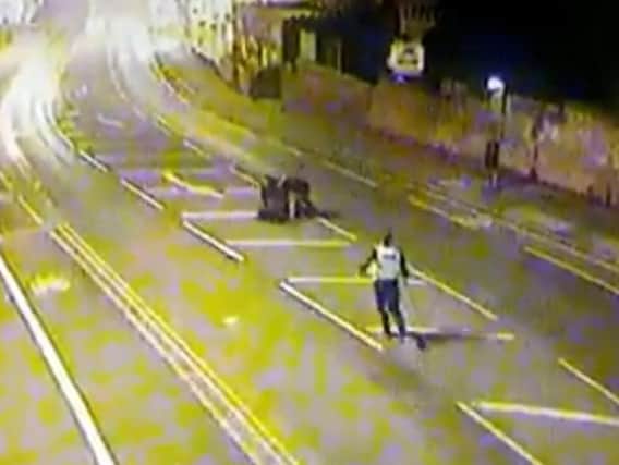 The wanted man had run off from officers but was rugby tackled to the ground by two friends