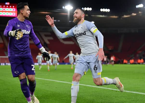 Derby County Captain Richard Keogh celebrates with goalkeeper Kelle Roos after scoring the winning penalty. (Photo by Dan Mullan/Getty Images)