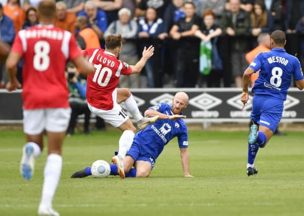 ChesterfieldÃ¢Â¬"s Drew Talbot slides in to tackle Salford's Danny Lloyd: Picture by Steve Flynn/AHPIX.com, Football: Vanarama National League match Salford City -V- Chesterfield at Peninsula Stadium, Salford, Greater Manchester, England copyright picture Howard Roe 07973 739229
