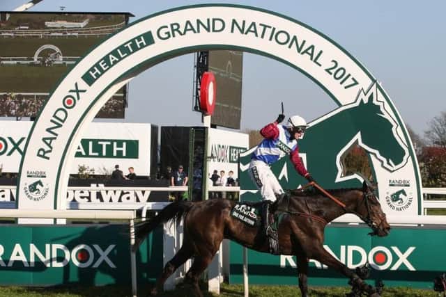 One For Arthur, ridden by Derek Fox, crosses the line to win the 2017 Grand National.