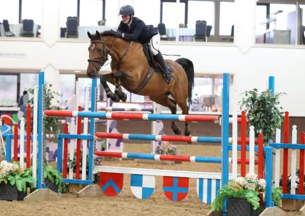 Kerry Brennan riding Wellington M to top spot in the Winter Grand Prix. (PHOTO BY: SBM Photographic).