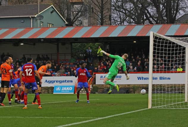 Chesterfield's Will Evans heads them in front against his former side Aldershot.