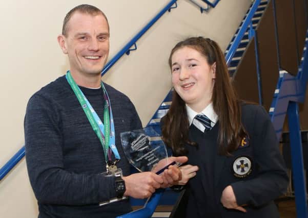 Orla Conneely receives her award as theYoung Disabled Sportsperson for 2018 from Paul Ryan, of the Chesterfield Schools Sport Partnership.