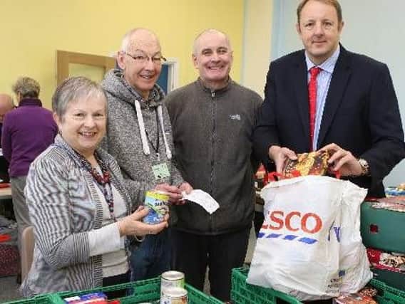 Chesterfield MP Toby Perkins on a recent visit to the foodbank alongside volunteers Yvonne Birchmore, Steven Atkins and Jim Hopkins.