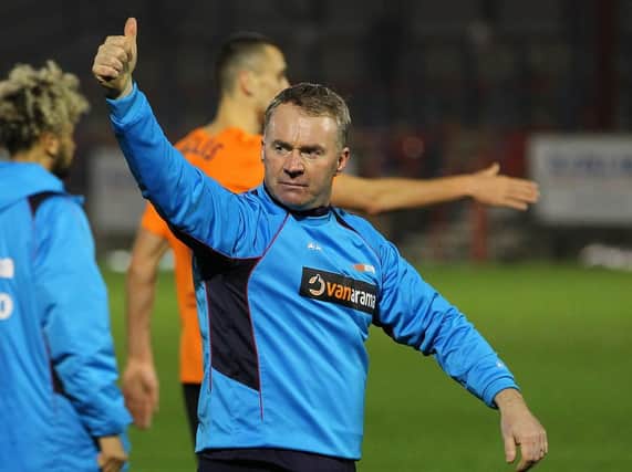 John Sheridan will see his Chesterfield side take on Brackley Town this weekend.