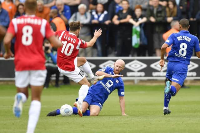 Chesterfieldâ¬"s Drew Talbot slides in to tackle Salford's Danny Lloyd: Picture by Steve Flynn/AHPIX.com, Football: Vanarama National League match Salford City -V- Chesterfield at Peninsula Stadium, Salford, Greater Manchester, England copyright picture Howard Roe 07973 739229