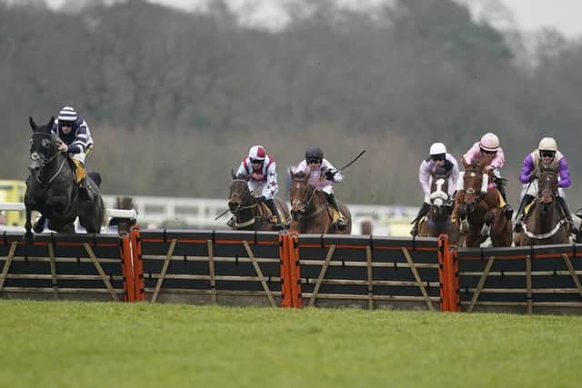 Favourite Al Dancer (far left), ridden by Sam Twiston-Davies, jumps the last flight to seal victory in the re-routed Betfair Hurdle at Ascot on Saturday (PHOTO BY: Alan Crowhurst/Getty Images).