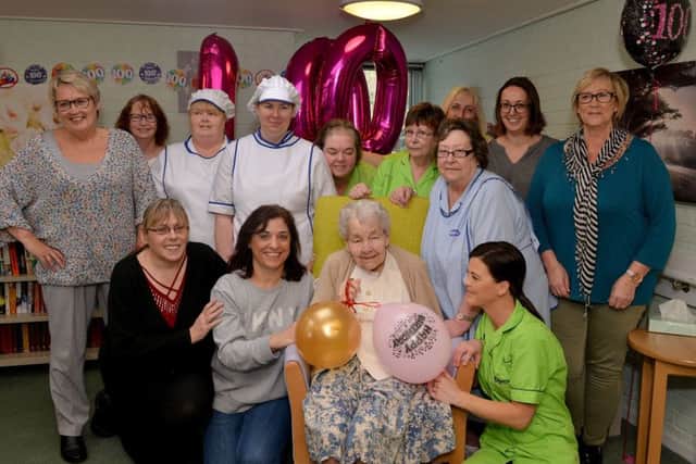 Rhoda Brassington celebrates her 100th birthday at The Spinney Care Home, Brimington. Rhoda is pictured with staff at the care home