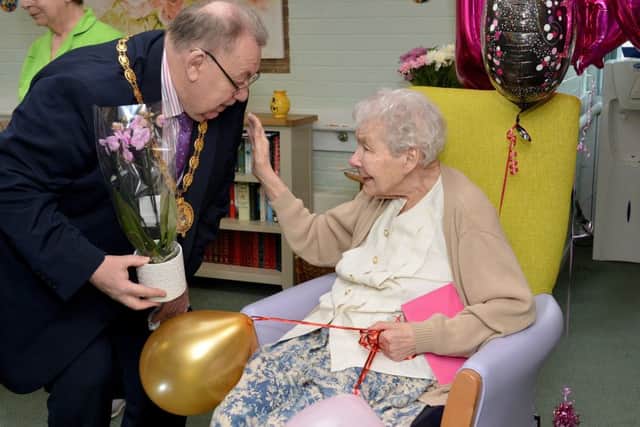 Rhoda Brassington celebrates her 100th birthday at The Spinney Care Home, Brimington. Rhoda is pictured with Derbyshire County Council Chairman Coun George Wharmby