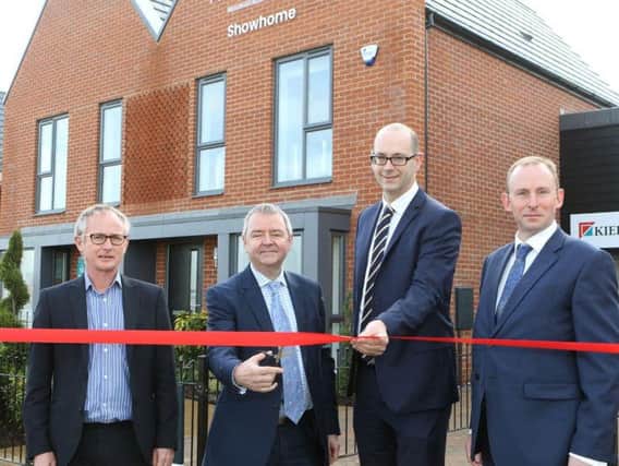 Martin Bessant, regional director at Kier Living, and Barry Cummins, of Homes England, are joined by councillors Graham Hill and Bryan Harrison for the official opening of the show homes at the development of the former Avenue coking plant. Picture by Jason Chadwick.
