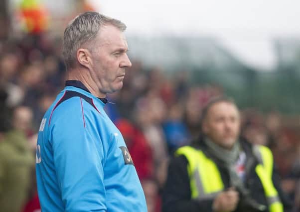 Picture Greg Dunbavand/AHPIX LTD, National League, Wrexham vs Chesterfield FC, Racecourse Ground, 02/03/19, K.O 3pm  Chesterfield manager John Sheridan watches on as his side face Wrexham.