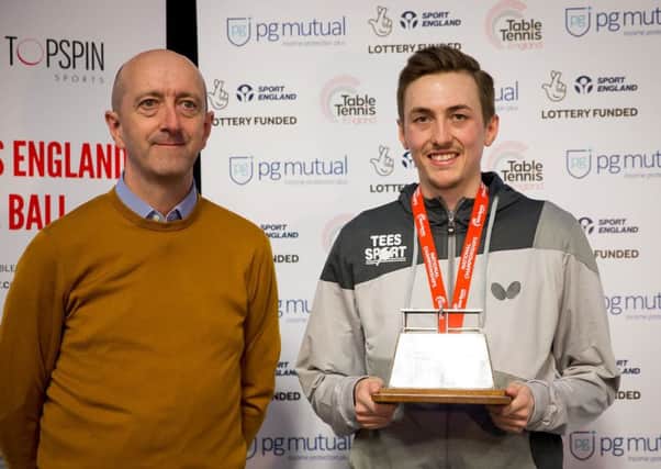 Liam Pitchford collects his trophy from Mike Perry, CEO of PG Mutual. Pic by Alan Man.