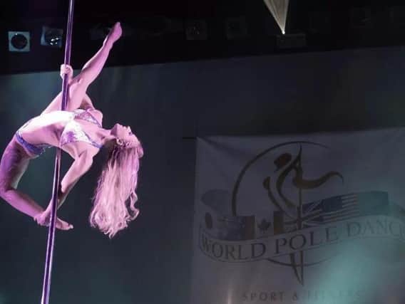 Lorna Walker  on stage at the World Pole Dance competition.