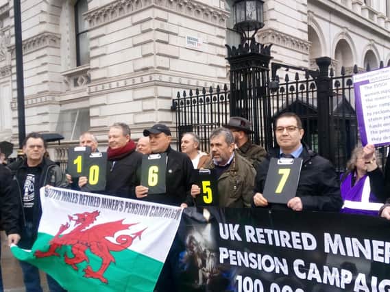 Former miners outside 10 Downing Street after handing over a 100,000 name petition.