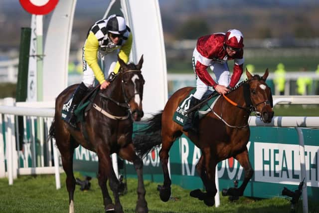 Grand National winner Tiger Roll (right), who is gunning to win for the fourth time at the Cheltenham Festival. (PHOTO BY: Alex Livesey/Getty Images).