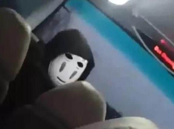 The masked man on the bus