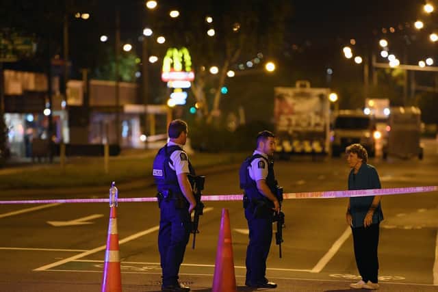 Police speak to a resident as they cordon off Linwood Avenue near the Linwood Masjid on March 15, 2019 in Christchurch, New Zealand. (Photo by Kai Schwoerer/Getty Images)
