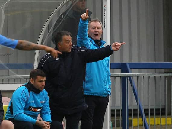 Glynn Snodin (centre) and manager John Sheridan (right) point the way against Havant & Waterlooville.