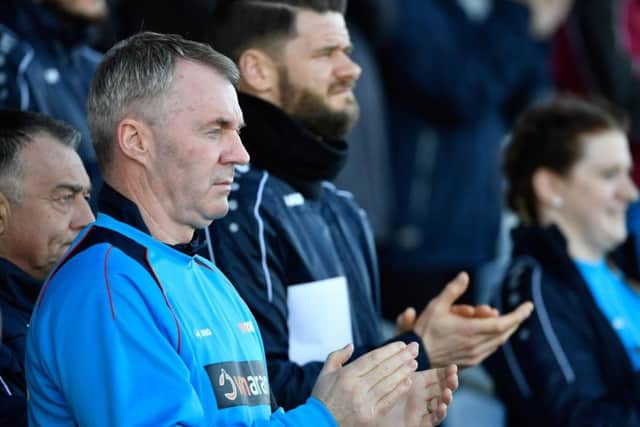 Michael Nelson, third from left, helps the management team on matchdays
