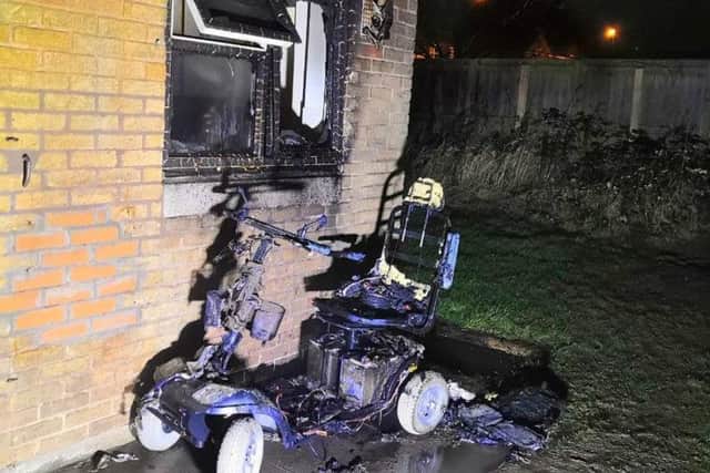 The fire-hit mobility scooter and window.