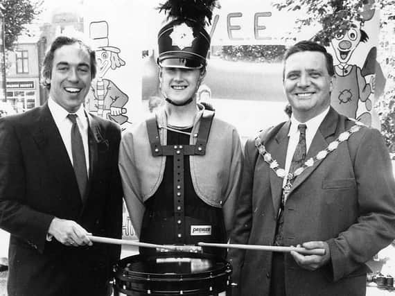 The mayor has a go on the drum at an Alfreton Fun Day event in the early 1990s.