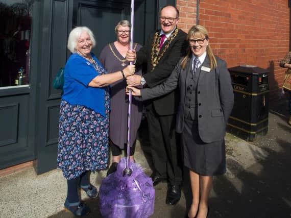 President of Central England Co-operative Elaine Dean, Mayoress of Chesterfield Anne Brittain, Mayor of Chesterfield Councillor Stuart Brittain and West Bars Funeral Director Margo Gasston unveil the blue plaque recognising the sites historic links to the Co-op.