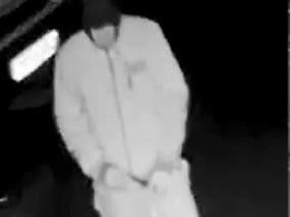 CCTV shows man damaging car in Chesterfield.